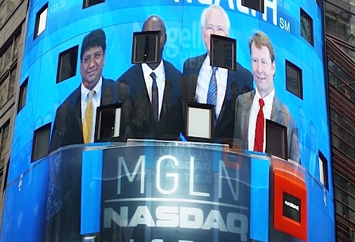 Magellan team on screen at NASDAQ